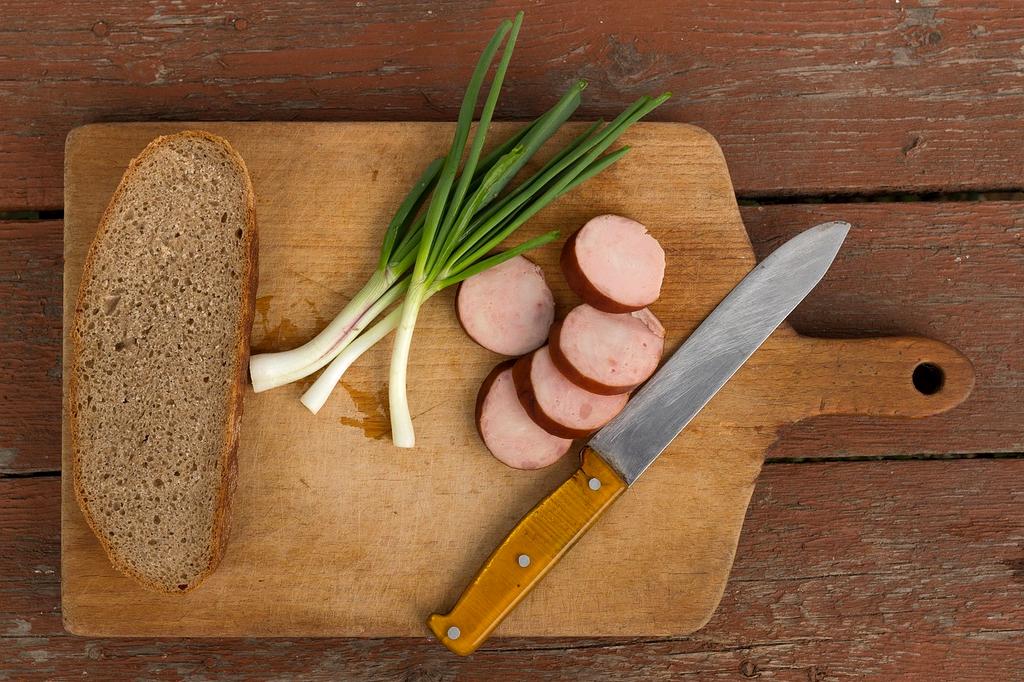 Open book on sustainable wellness with coffee and plant in background